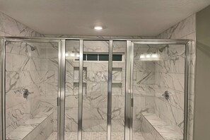 Combined shower/bathtub, hair dryer, towels, soap