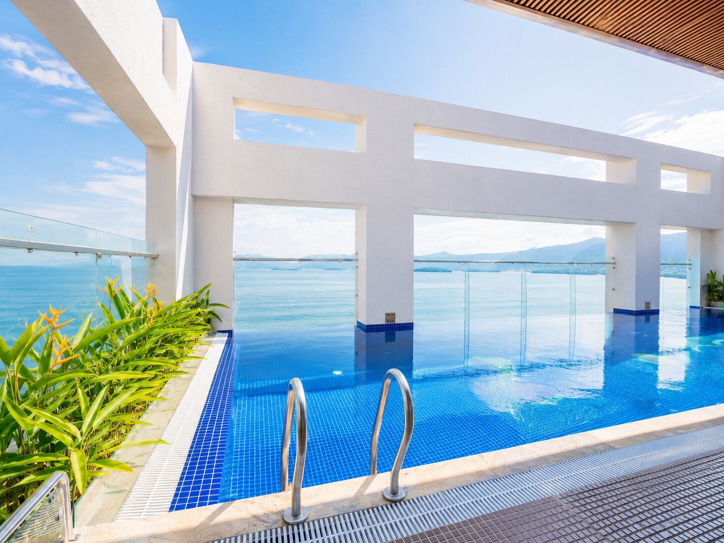 Outdoor pool, pool loungers, lifeguards on site