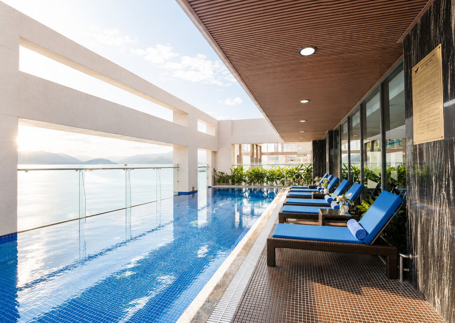 Outdoor pool, pool loungers, lifeguards on site