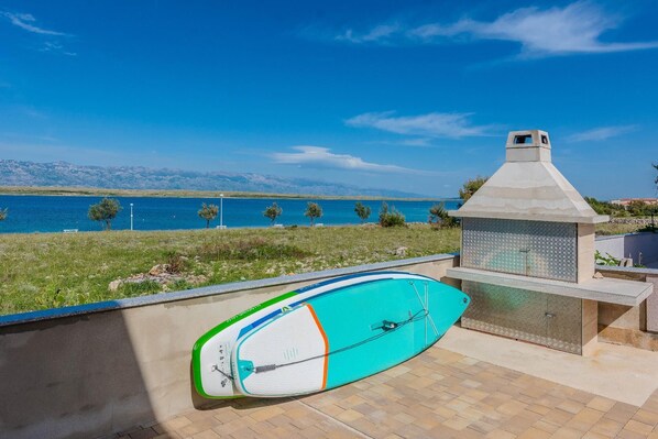 Enjoy serene views of the lake and mountains from this outdoor space, where you can paddle, dine, or relax.
