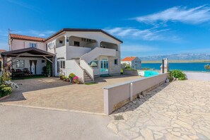Enjoy a scenic view from this two-story property with a pool and spacious patio area.
