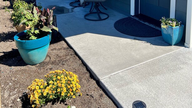 A house with a porch, outdoor seating, and potted plants. - Cozy studio located near  Marina, hiking trails & downtown Sequim. Pet friendly. (Sequim)