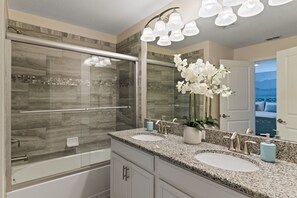 Combined shower/bathtub, hair dryer, towels, soap