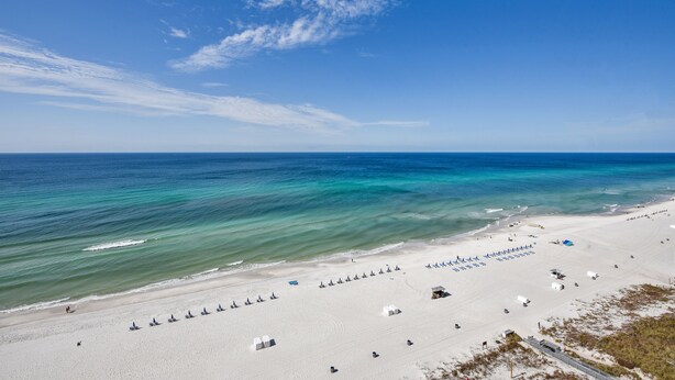 A beach with white sand, clear turquoise water, and a clear sky. - FREE Activities! Summer Deals!! Beach Access w/ Amazing 16th Floor Views! (Panama City Beach)