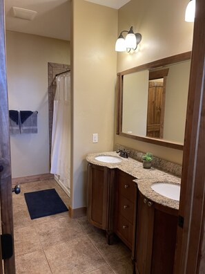 Combined shower/tub, hair dryer, towels, soap