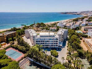 Enjoy stunning views of the coastline from this hotel's scenic location, surrounded by lush greenery and a tennis court nearby.