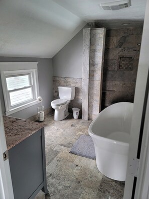 Combined shower/bathtub, towels, soap, toilet paper - Quaint 2-story house near Fountain Square (Indianapolis)