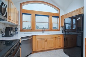 Fridge, microwave, oven, stovetop - 1879 - Beau's Sandcastle, 5-bedroom, 4.5-bathroom home in Corolla, NC, private pool (Corolla)