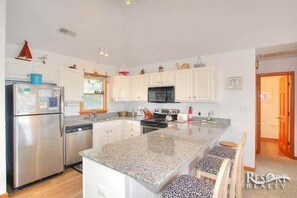 Fridge, microwave, oven, stovetop - 2510 - Duck Dunes, home with private pool and lifeguard station at beach access (Duck)