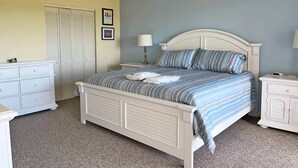 A bedroom with a bed, nightstands, a dresser, and a closet. - 2948 - Duck Nest, Perfect for smaller families or couples with unparalleled ocean views & amenities (Duck)