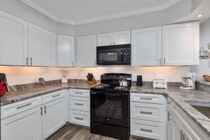 Fridge, microwave, oven, stovetop - 4104 - Sever's Hideaway, Cozy oceanfront condo offers the comforts of home but with an upgraded view (Duck)