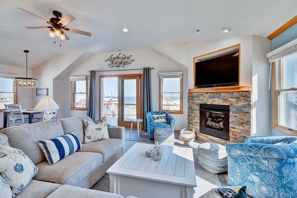 Flat-screen TV, fireplace, DVD player, books