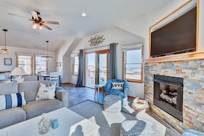 Flat-screen TV, fireplace, DVD player, books
