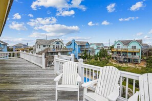 Stroll along the boardwalk to charming coastal homes with balconies and porches.