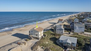 A coastal residential area with houses near the beach and ocean. - 6300- Sea Master, OBX Oceanfront Escape | Jacuzzi & Views (Nags Head)