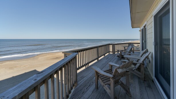 A wooden deck with beach chairs overlooking the ocean. - 6300- Sea Master, OBX Oceanfront Escape | Jacuzzi & Views (Nags Head)