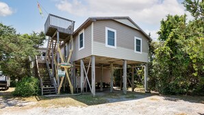 A two-story house with a wooden deck and a staircase leading to the upper floor. - 7563- Sea Dreams, 200 Yards to Beach | Pool Access in Avon (Avon)