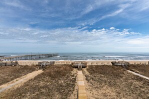 Walk along the boardwalk to our beachside huts, offering scenic views of the ocean.