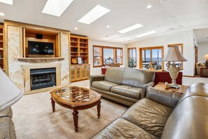 Flat-screen TV, fireplace, video games, DVD player
