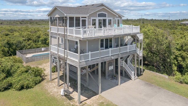 A two-story house with a balcony and a pool. - 5788- Birds Eye View - Beach Getaway in Nags Head | Private Pool (Nags Head)