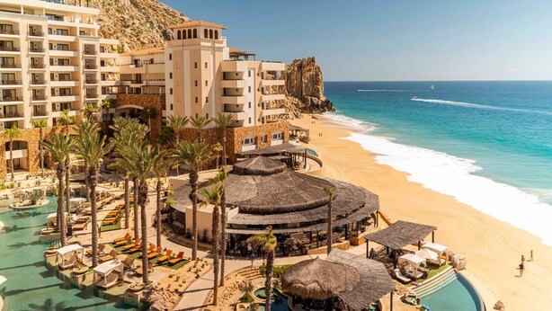 A resort with a pool, beach, and ocean view. - Ocean front over looking the arch in Cabo San Lucas, with golf access (Cabo San Lucas)