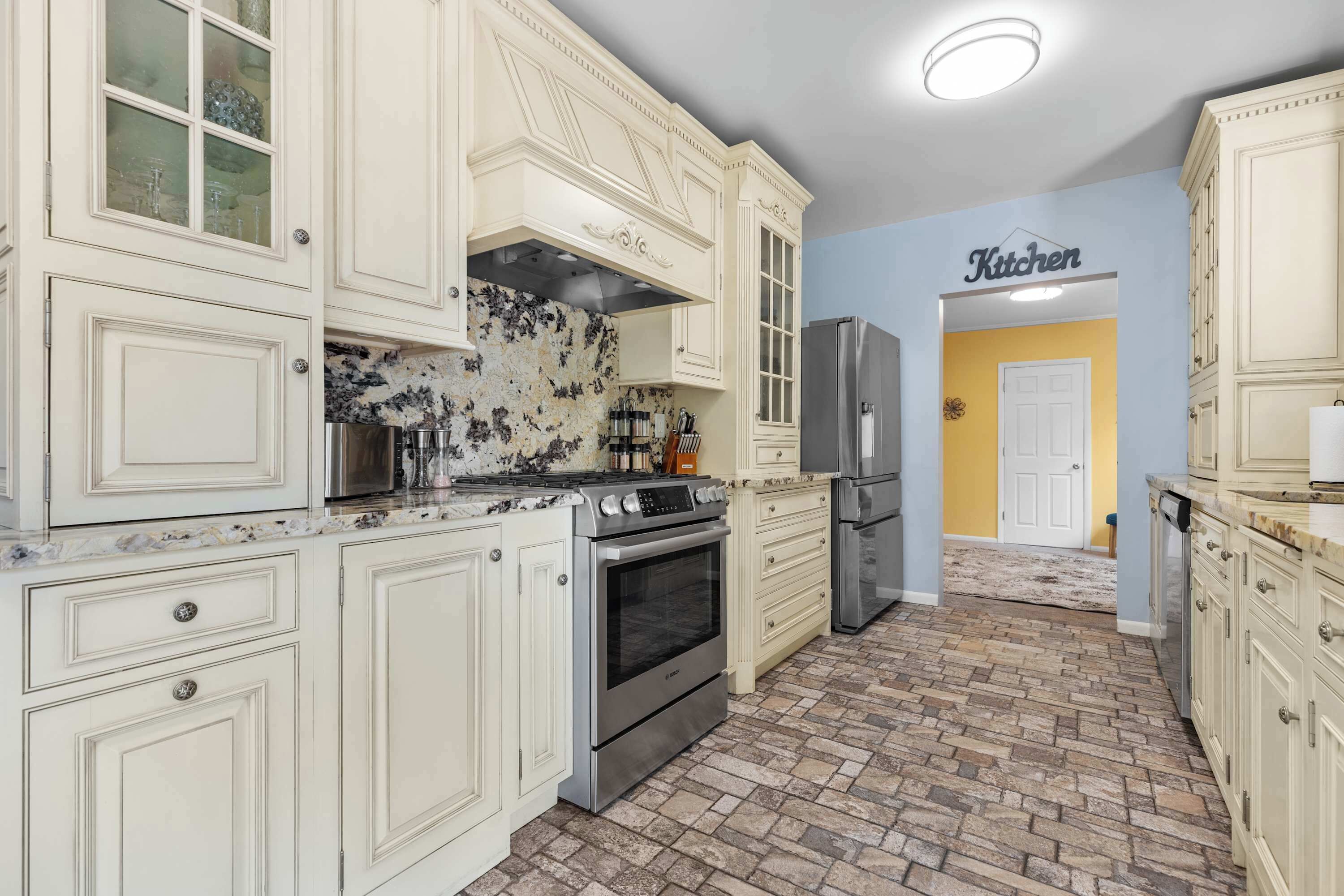 Fridge, stovetop, dishwasher, coffee/tea maker