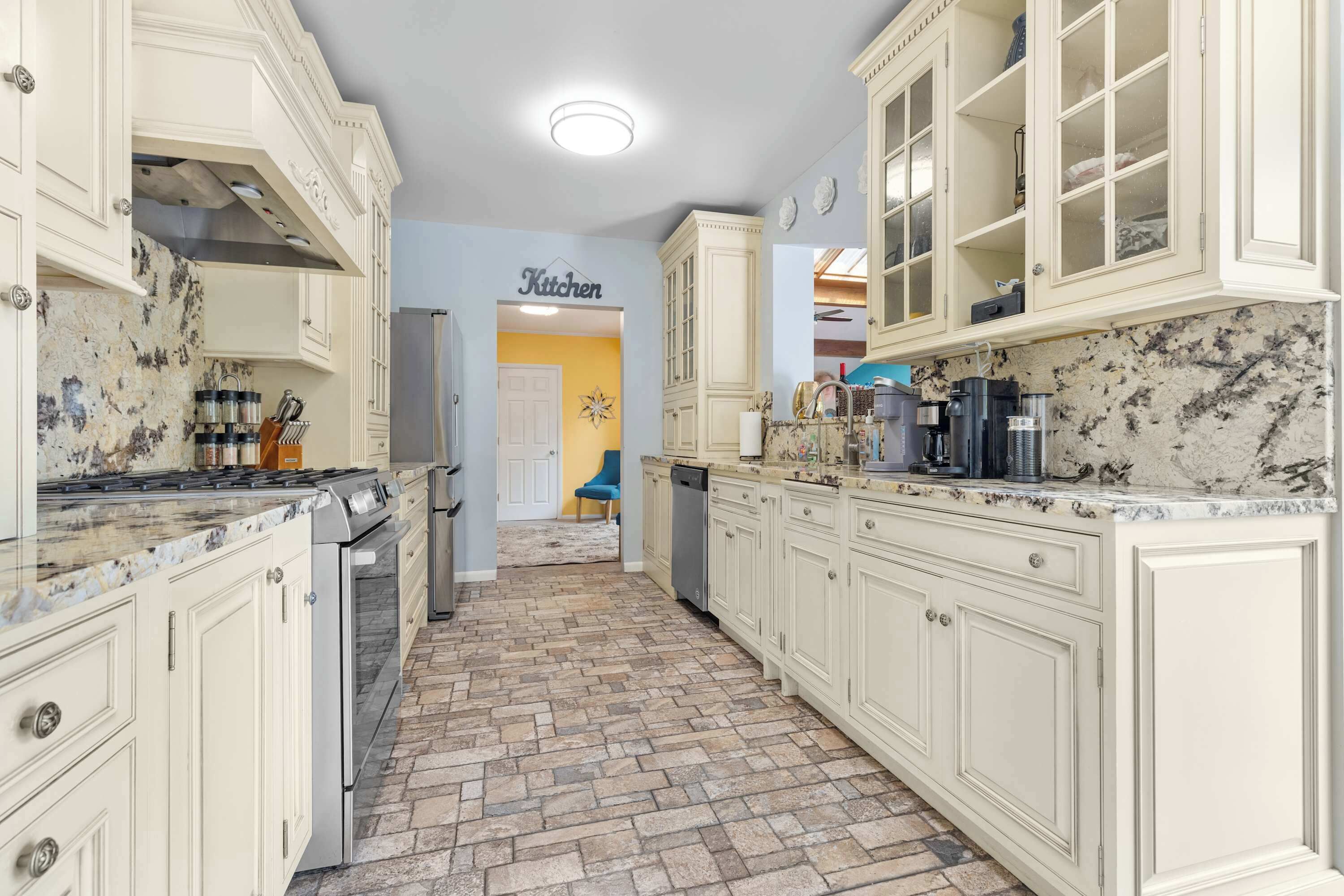 Fridge, stovetop, dishwasher, coffee/tea maker