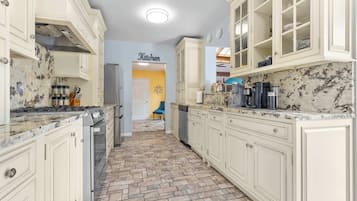 Fridge, stovetop, dishwasher, coffee/tea maker