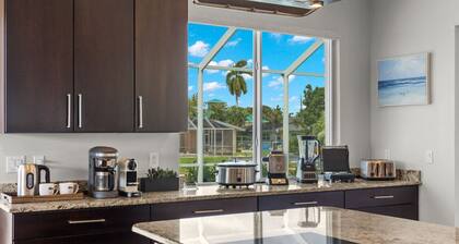 Luxury home w/ 2 suites, LARGE pool, spa, lanai. Quick gulf access! 6 Bikes! EV!