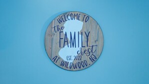 A circular wooden sign with the text "WELCOME TO the FAMILY" and "EST. 2022 AT WILDWOOD, NJ". - Newly remodeled 3 BR, 2 Bath shore house sleeps 10. (Wildwood Crest)