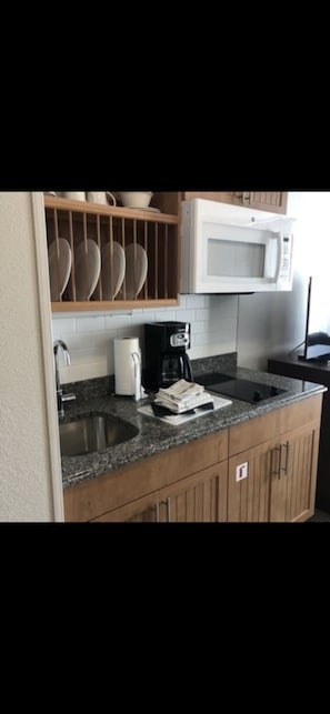 Fridge, microwave, stovetop, coffee/tea maker