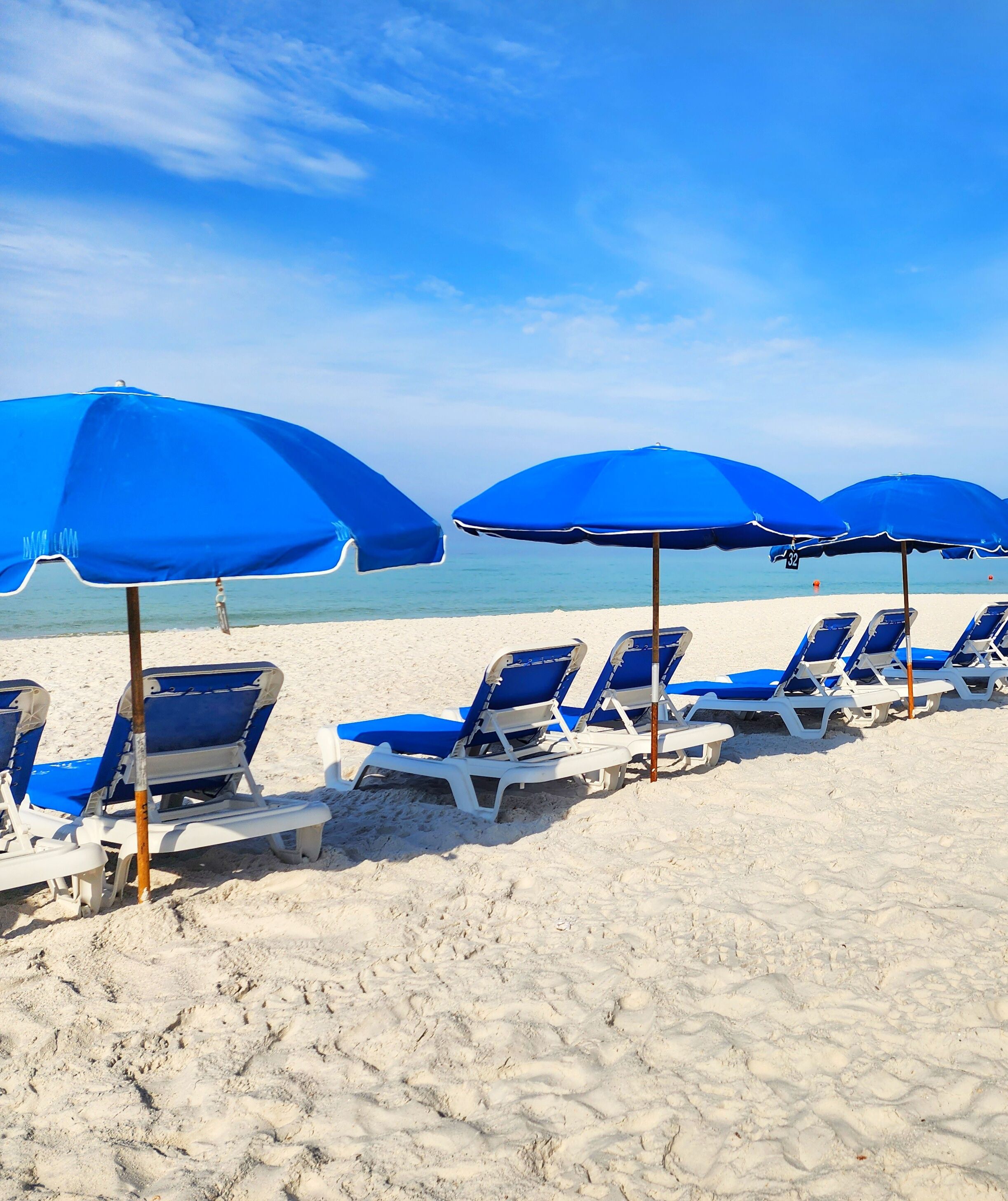 On the beach, sun-loungers
