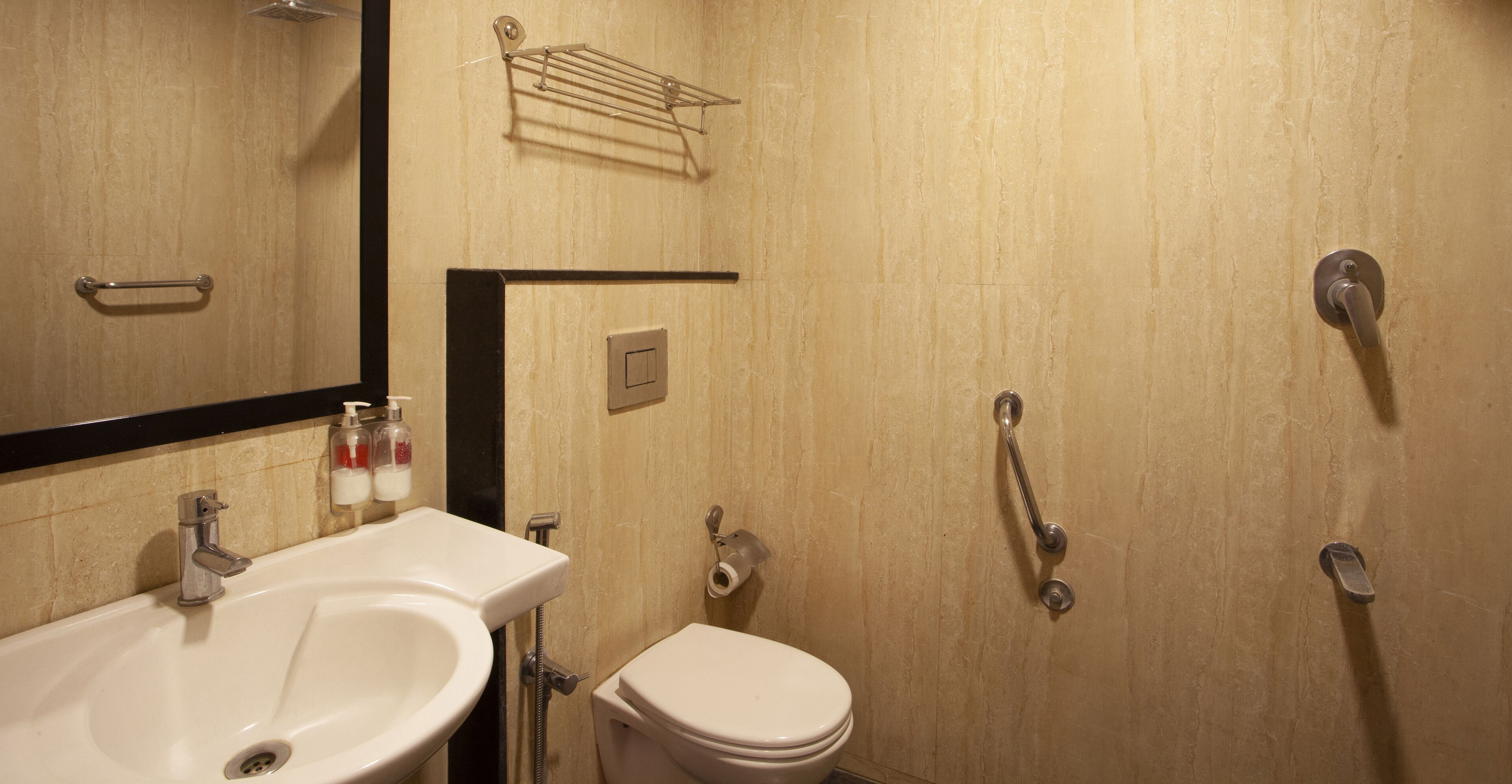 A bathroom with a sink, toilet, and shower.
