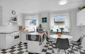 Fridge, stovetop, dishwasher, coffee/tea maker