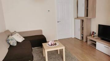 House | Living room | 30-inch TV with cable channels