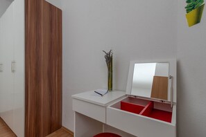1 bedroom, desk, iron/ironing board, travel crib