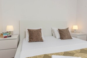 1 bedroom, desk, iron/ironing board, travel crib