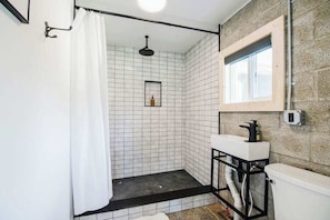Shower, hair dryer, towels, shampoo