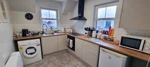 Fridge, microwave, oven, stovetop - HEART OF INVERNESS MODERN APARTMENT (Inverness)