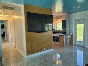 A modern kitchen with a built-in microwave, a sink, and a window. - Singer Island 2 bedroom w/ free parking- no stairs (North unit) (Palm Beach Shores)