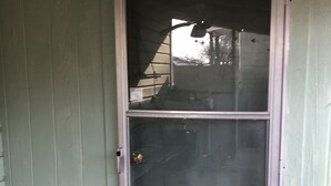 A closed door with a glass panel and a brass handle. - Tiny casita in beautiful Uvalde, 20 minutes from Frio River (Uvalde)