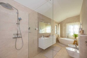 Bathtub, hair dryer, towels