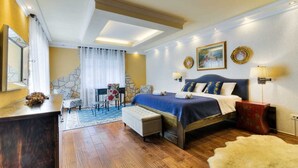 A bedroom with a large bed, a desk, a chair, and a small table. - Villa Luxview 17 Bribir (Bribir)