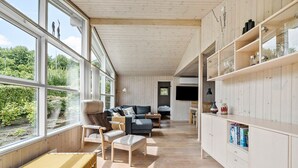 A spacious living area with a sofa, chairs, and a wooden bookshelf. - Lovely home in Haderslev with WiFi (Haderslev)