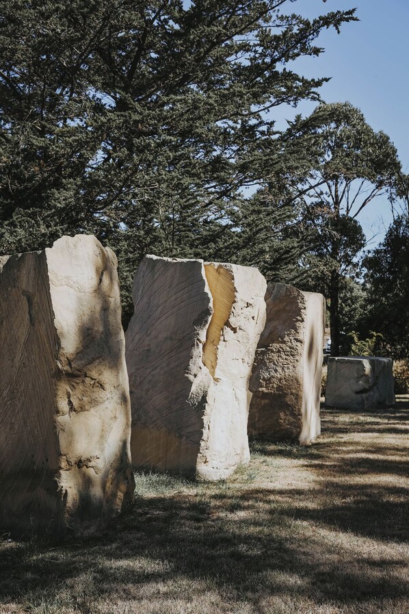 Large stone structures in a natural setting with trees in the background. - Iron Creek Bay Estate (Sorell)