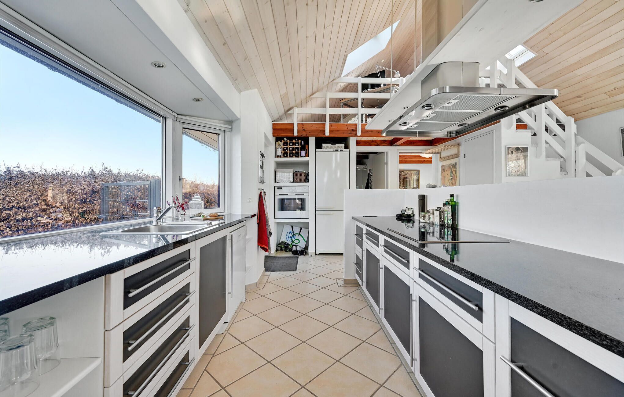 Fridge, stovetop, dishwasher, coffee/tea maker