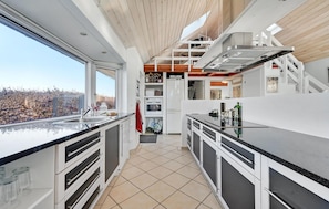 Fridge, stovetop, dishwasher, coffee/tea maker