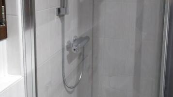 Shower, hair dryer, bidet, toilet paper