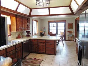 Enjoy meals in the kitchen with a central island and dining area.