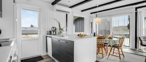 Fridge, stovetop, dishwasher, coffee/tea maker